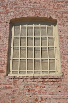 Old window in brick wall Stock Photos