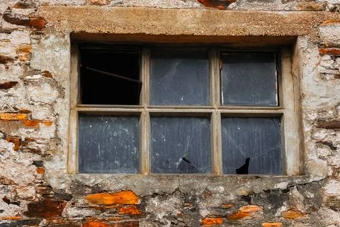 Old window with broken glass Stock Photos