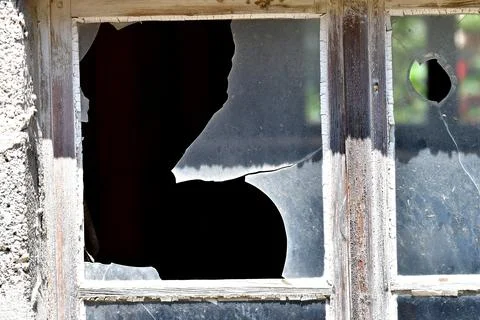 Old window with broken glass Stock Photos