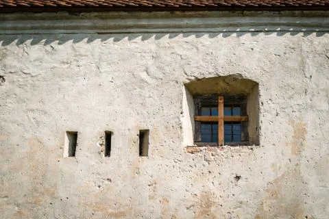 Old window in the castle wall Stock Photos