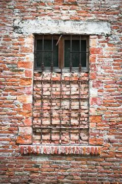 Old window closed with bricks. Stock Photos