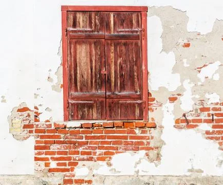 Old window with closed shutters Stock Photos