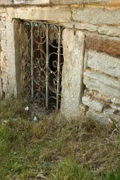 Old window on a concrete wall. Outside, house. Fotos de archivo