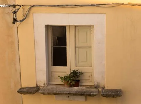 Old window in the courtyard Stock Photos