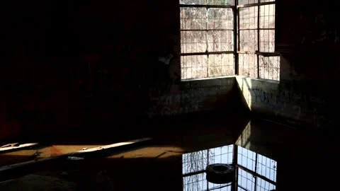 An old window creates a mood on the floor of an abandoned building, 4k Stock Footage 337204586