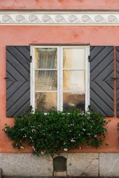 An old  window with flowers Stock Photos