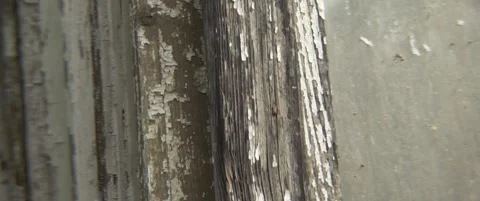 Old window frames with peeled off paint 5.7K anamorphic video Stock Footage 304574620