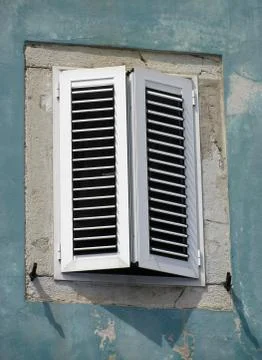 Old window on green wall Stock Photos