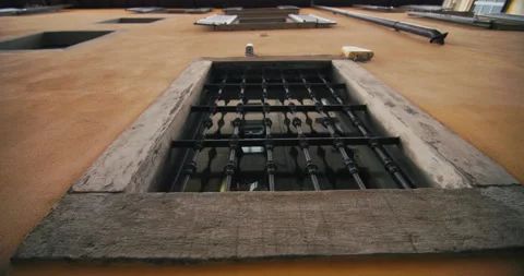 Old window with grill in stone house historical architecture. Stock Footage 276305959