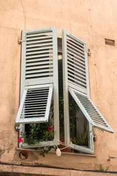 An old window with half-open shutter Stock Photos