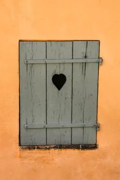 Old window with heart in St Tropez Stock Photos