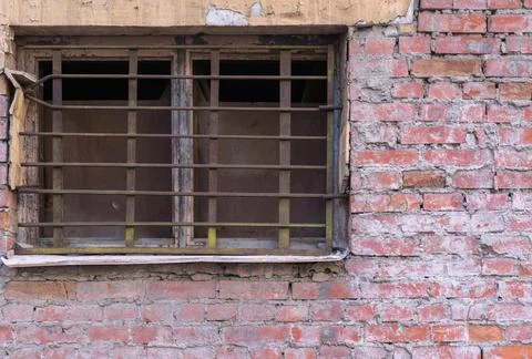 Old window with lattice on brick wall Stock Photos