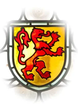 Old window with lion emblem Stock Photos