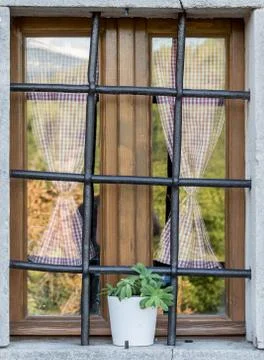 Old window with metal bars Stock Photos