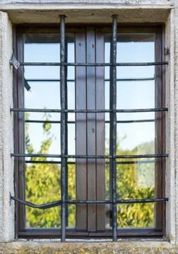Old window with metal bars Stock Photos