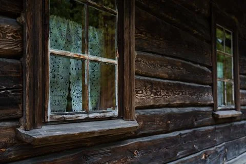 An old window of an Old Slavic, rustic house. Wooden house Stock Photos
