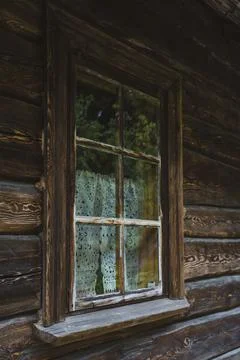 An old window of an Old Slavic, rustic house. Wooden house Stock Photos
