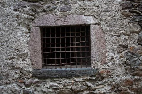 Old window in the old wall Stock Photos