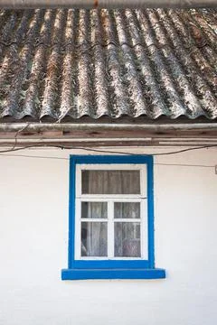 Old window outside a rustic white house Stock Photos