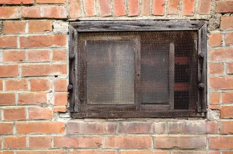 Old window on red brick wall Stock Photos