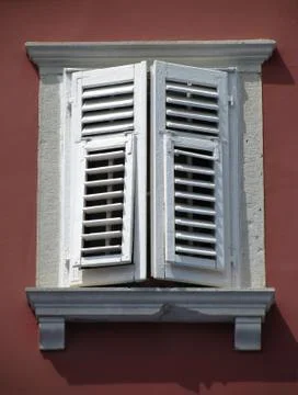 Old window on red wall Stock Photos