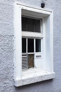 Old window with shutters, window with broken glass. white window. Stock Photos