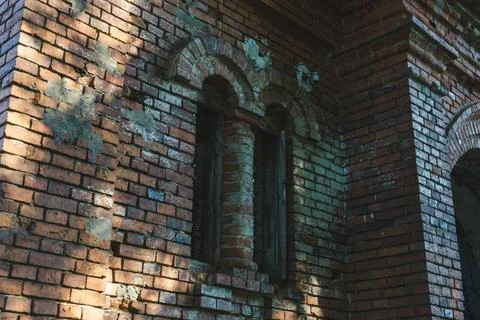 The old window of the stable is made of red brick. 19th century buildings. Stock Photos