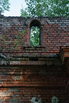 The old window of the stable is made of red brick. 19th century buildings Stock Photos