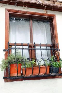 Old window on a white wall. Stock Photos