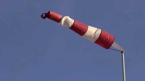 Old windsock in airfield showing wind strength on  sky background Stock Footage 12525364