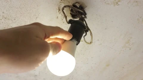 Old wire light bulb. Dilapidated wires of an old electric light bulb. Stock Footage 173326494