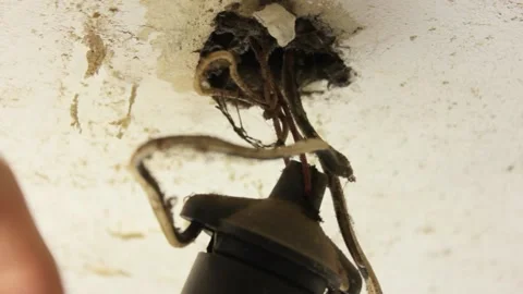 Old wire light bulb. Dilapidated wires of an old electric light bulb. Stock Footage 173326550