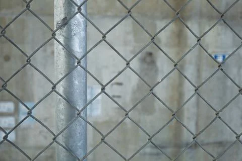 An old wire mesh with a diamond pattern. Stock Photos