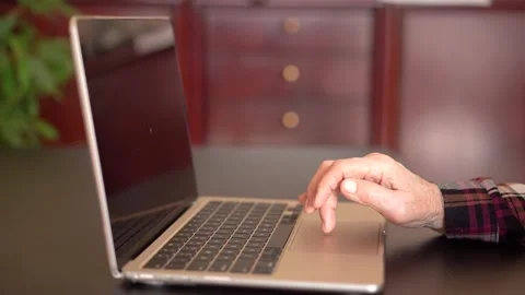 Old woman eighty years old sitting with laptop Stock Footage 252826317