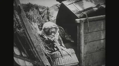 Old woman hiding between ruins Stock Footage
