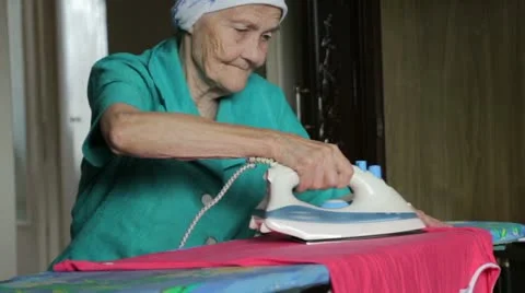 Old woman ironing Stock Footage 22105553