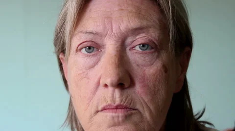 Old woman looking at camera Stock Footage 57256074