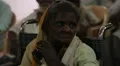 Old woman with no fingers applauding in India HD Footage