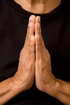 Old woman praying Stock Photos
