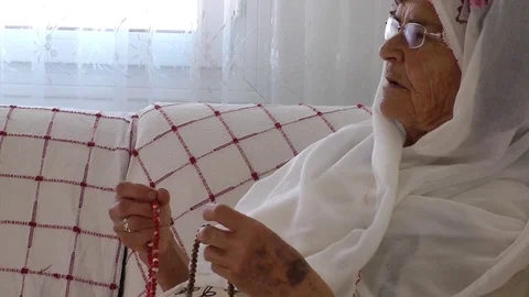 Old Woman Prays with Rosary Stock Footage