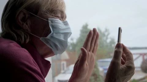 Old Woman In Self Isolation Communicates With Family On Video Link On Her Phone Stock Footage 141685252