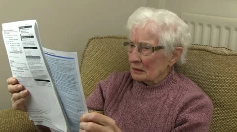 An old woman sorting through her bills Stock-Footage 20458313