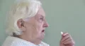 Old woman is taking medicine HD Footage