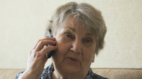Old woman talking on a mobile phone Stock Footage 62492425