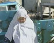 Old woman walking SD Footage