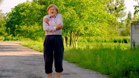 The old woman's arm hurts. Selective focus. Stock Footage 282650352