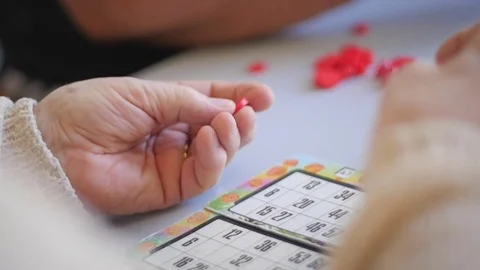 Old woman's hands playing bingo 스톡 동영상 76557714