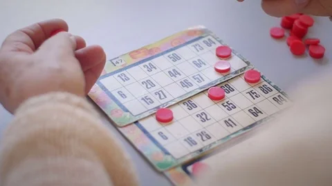 Old woman's hands playing bingo Stock Footage 76558494