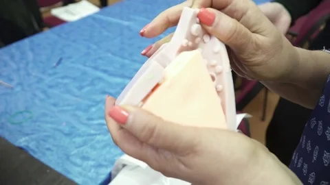 Old woman's hands taking out the handmade soap from the template Stock Footage 74361645