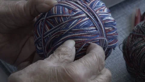 Old woman's hands with threads Stock Footage 144637813